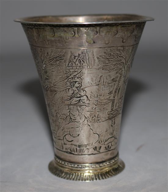 An 18th century German? parcel gilt silver beaker, 48 grams.